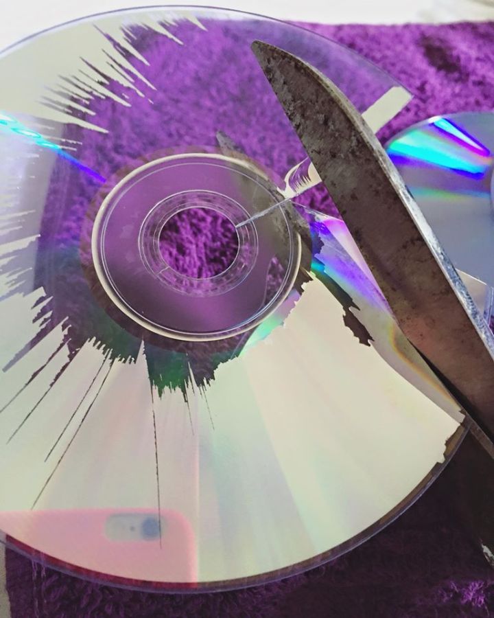 Start cutting the CD in triangles